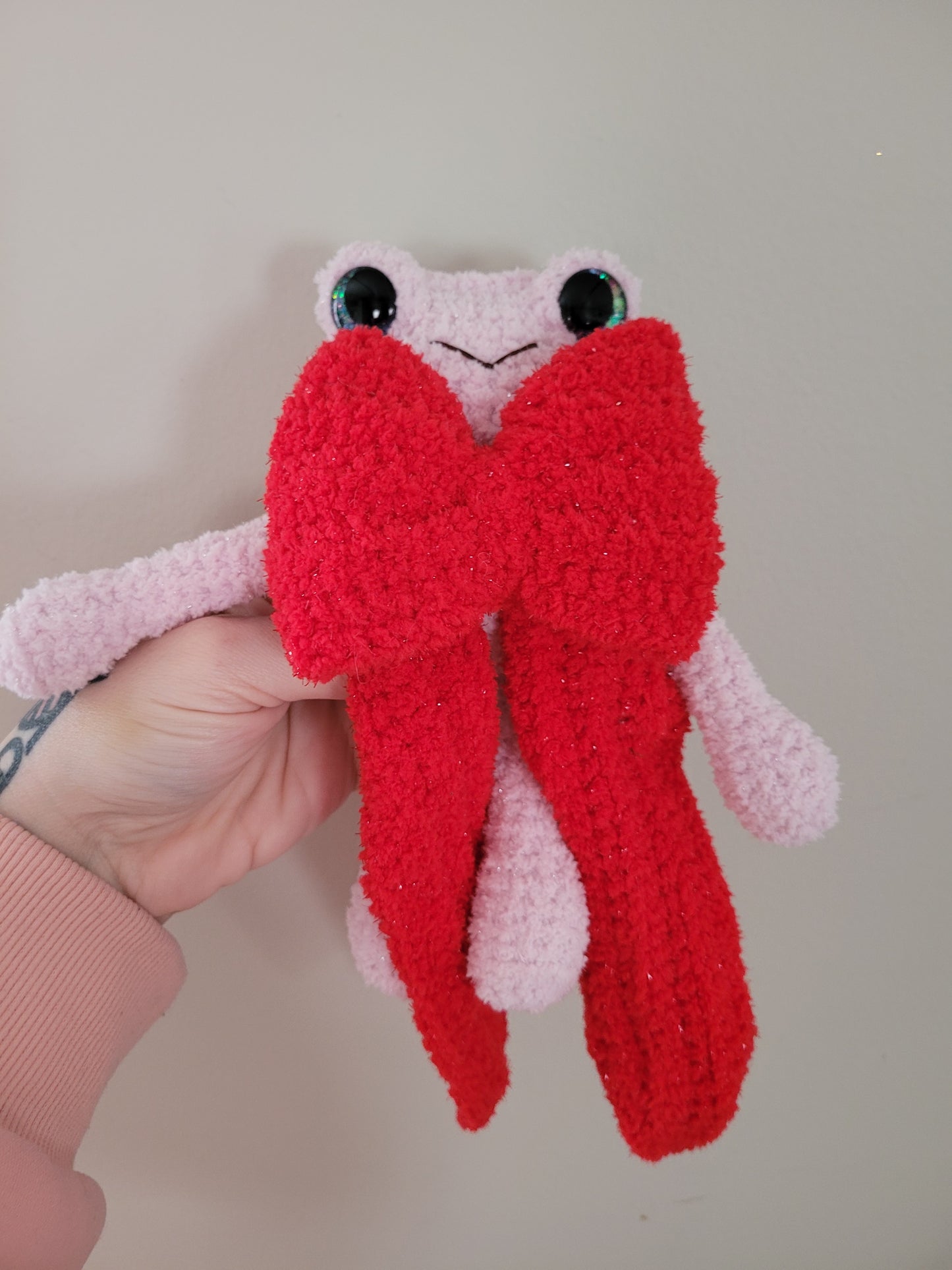 LuvKnotz Medium Pink Fuzzy Frog with Red Bow Handmade Crochet - Soft Chenille Yarn, Approx. 10" Long, Purple Blue Glitter Eyes, OOAK stuffed animals